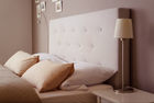 Upholstered headboard brings comfort and coziness to the bedroo